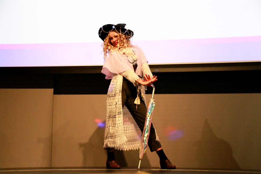 Cosplay contest entrant modeling on stage